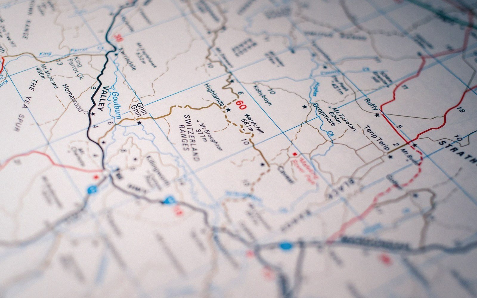 Close-up of a road map showing highways, rivers, and rural place names in fine detail